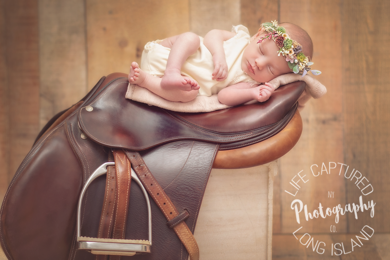 Sweet Baby on Horse Saddle | Suffolk County Newborn Photography